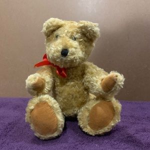 Stuffed bear with red bow